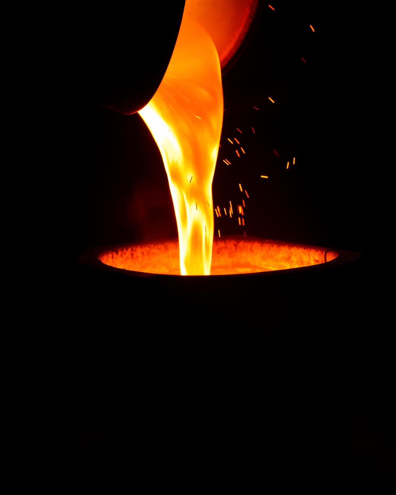 Molten metal pouring into a foundry crucible — the Foundry Web Solutions metaphor for crafted, durable websites.